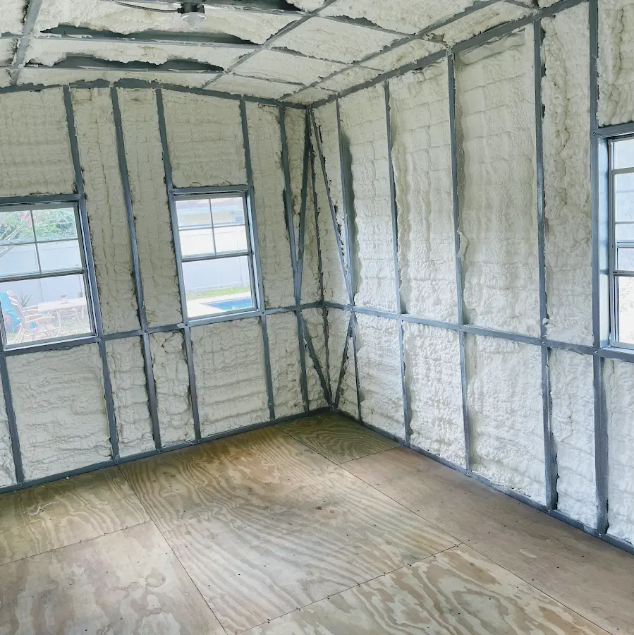 Closed-cell spray foam insulation applied to wall cavities in a residential project in Alma